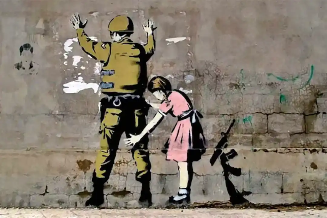 Graffiti de Banksy en calle de Buenos Aires